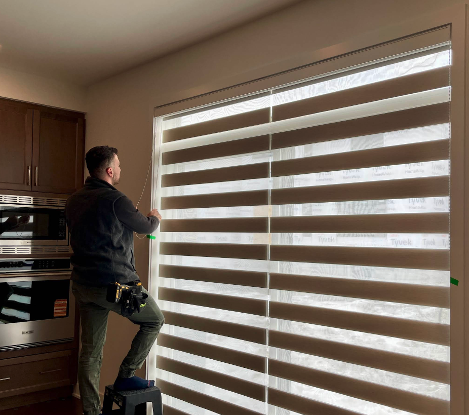 The Blind certified installer measuring a window in an Ottawa-Gatineau home